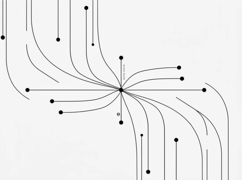 A creative workspace with a laptop, notebook, and coffee cup on a wooden desk